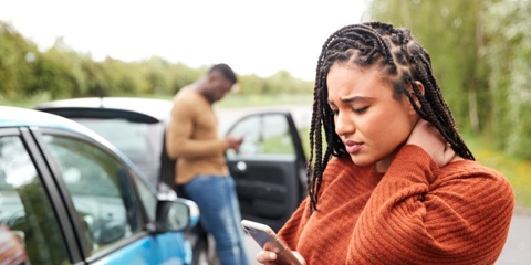 woman on the phone after a car accident