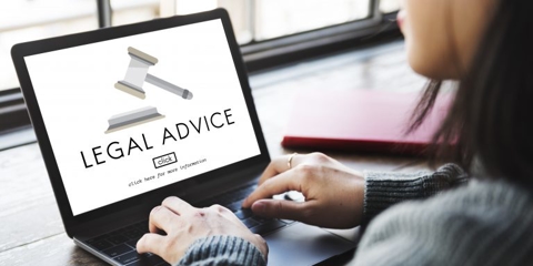 Woman looking up legal advice on a computer