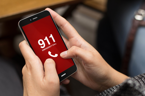 Person calling 911 on their phone