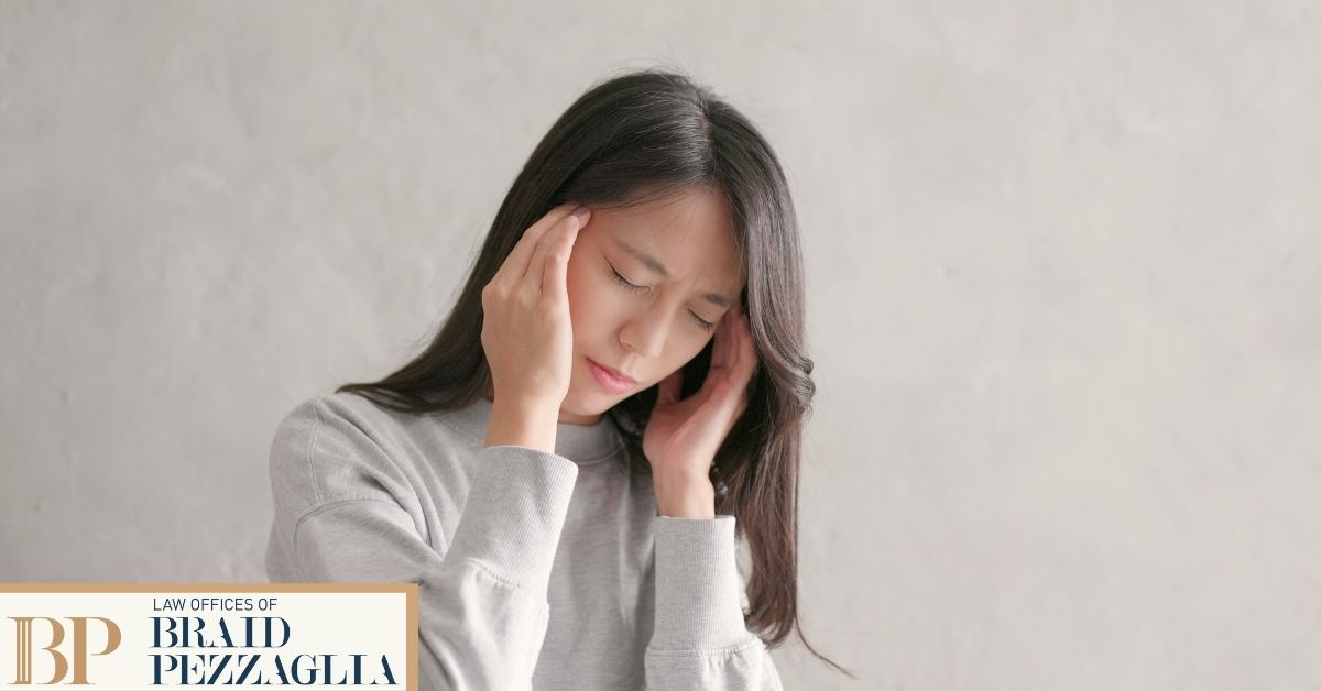 Distressed woman holding her head