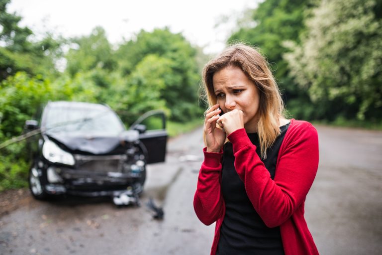 woman on the phone after a car accident