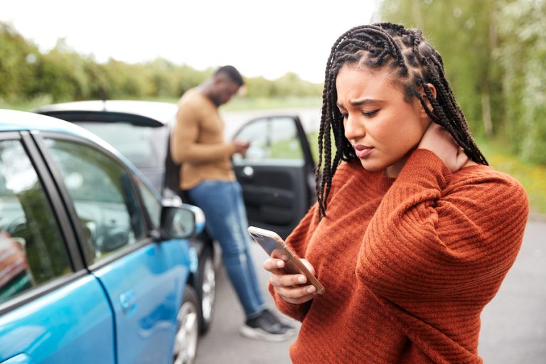 woman on the phone after a car accident